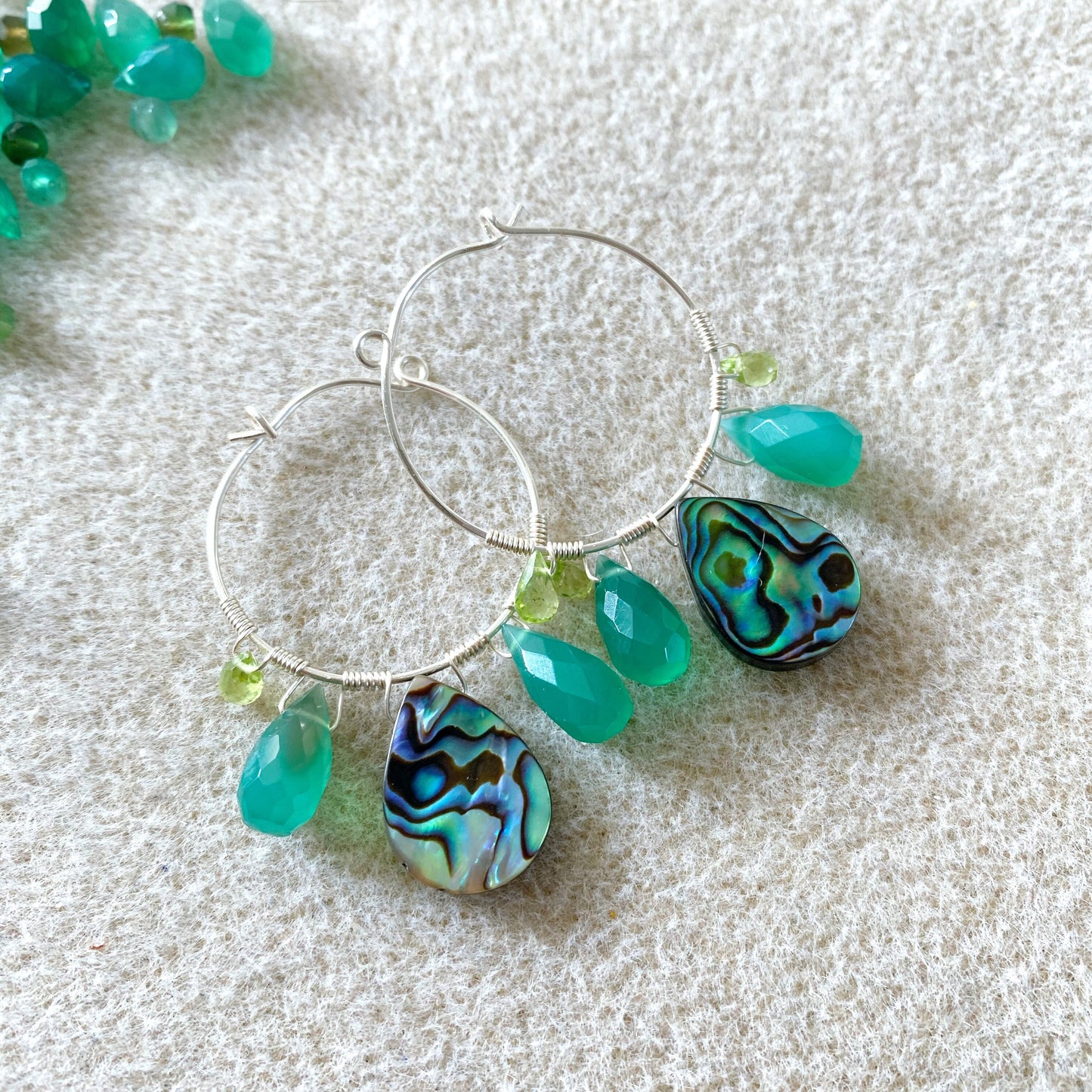 Peacock feather earrings with abalone, green onyx and peridot
