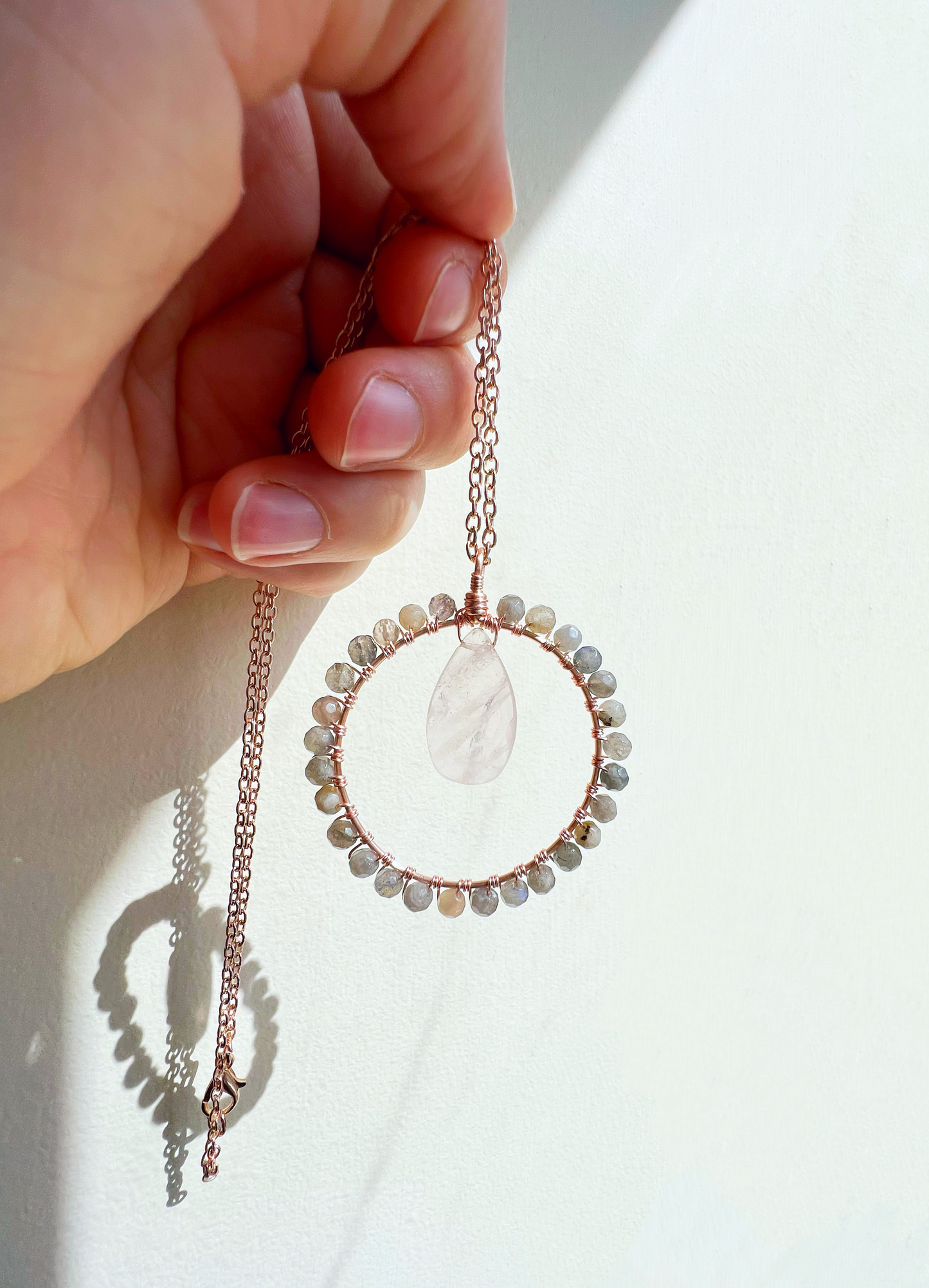 Rose quartz and labradorite Crystal Circle Necklace on rose
