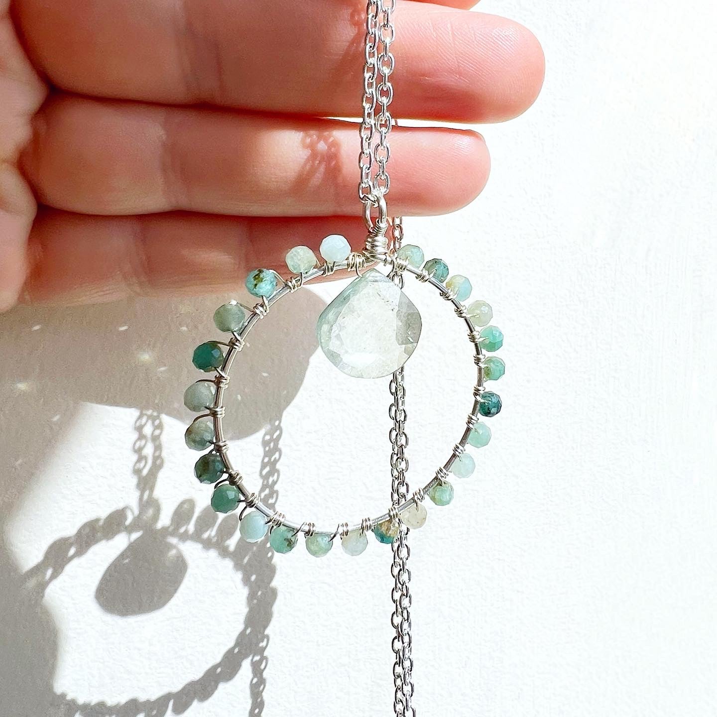 Grandidierite and green quartz crystal circle necklace