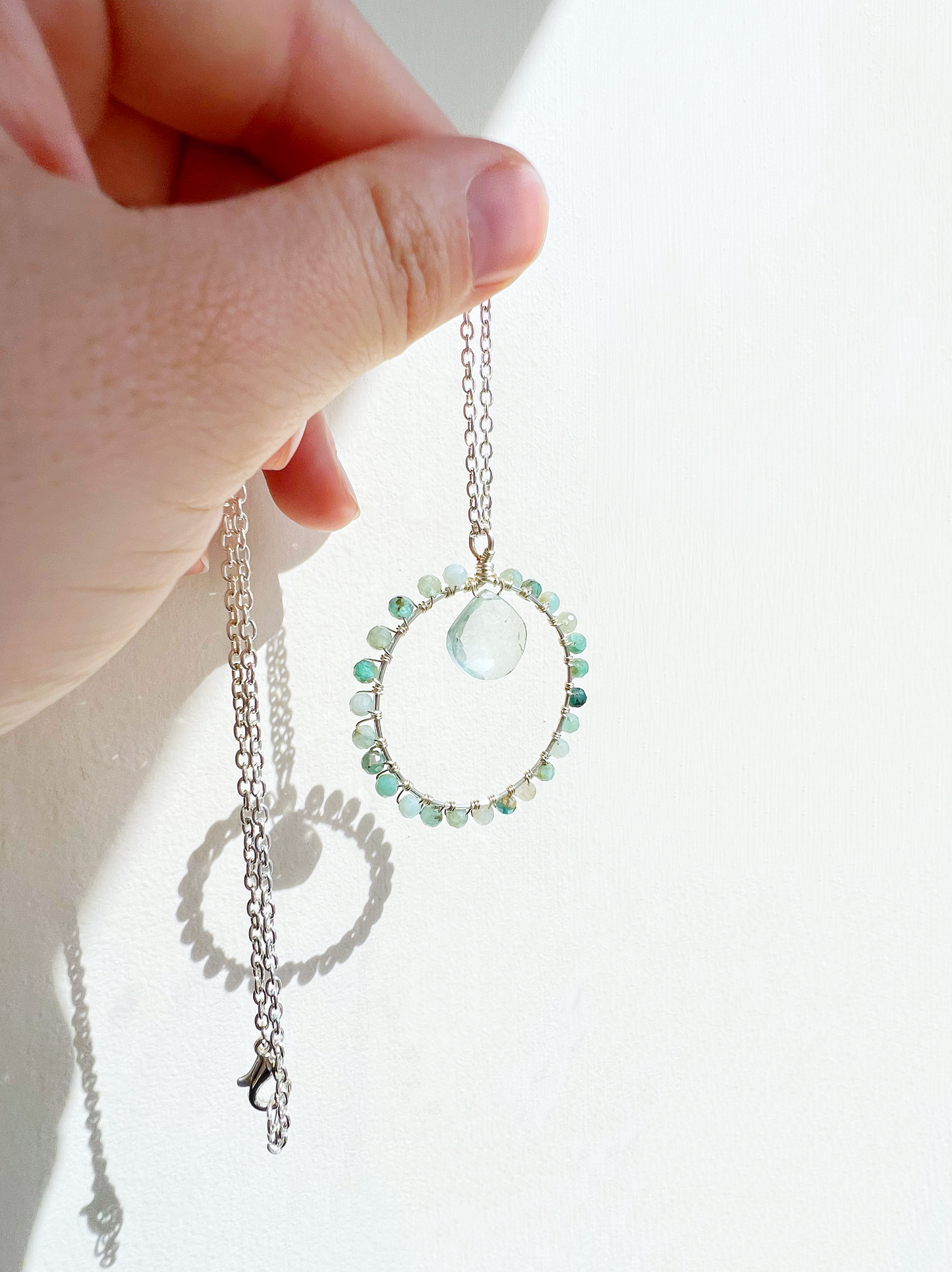 Grandidierite and green quartz crystal circle necklace