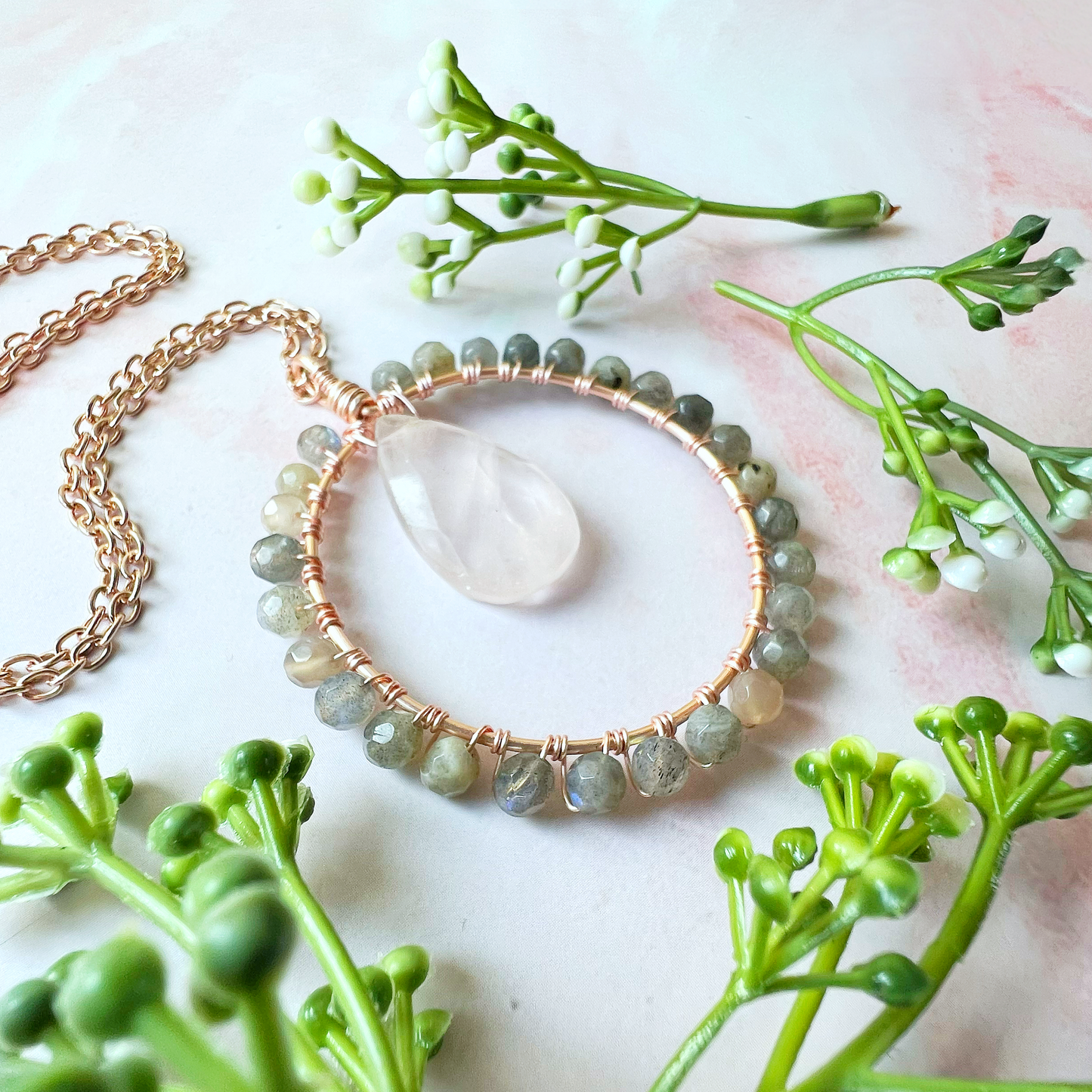 Rose quartz and labradorite Crystal Circle Necklace on rose