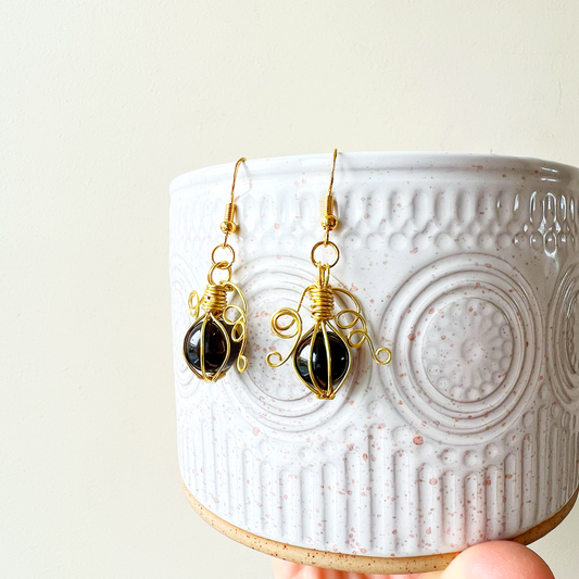 Garnet pumpkin earrings in gold