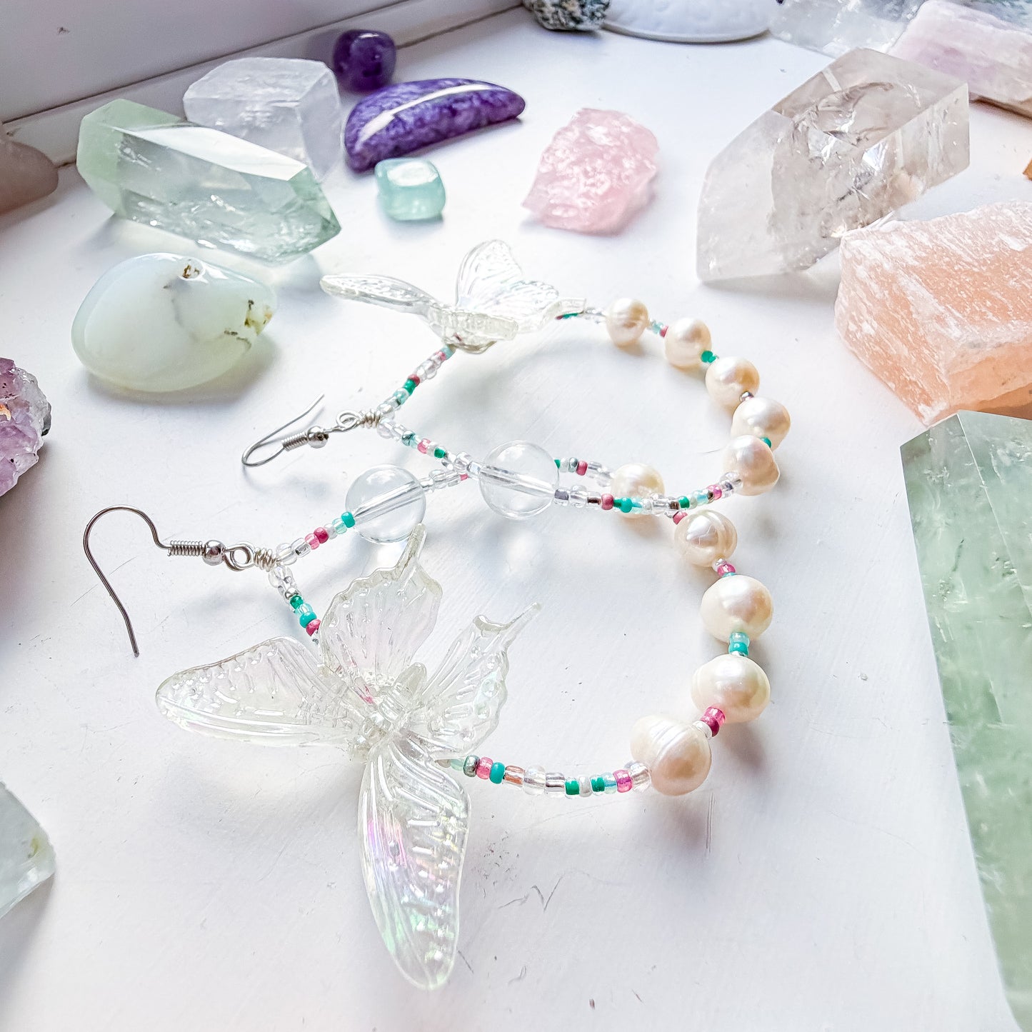 First Flutter - Clear quartz and iridescent butterfly + pearl & teal & pink seed bead earrings